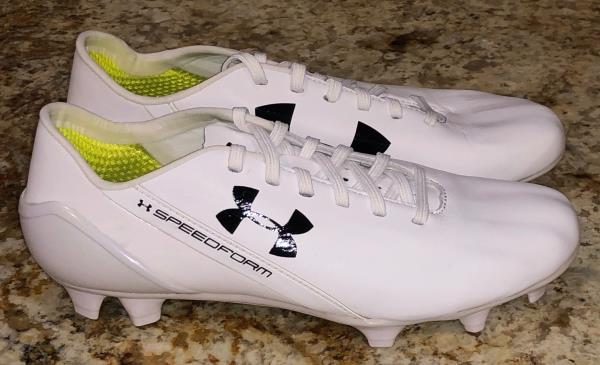 white leather soccer cleats